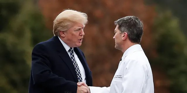 Dr. Ronny Jackson, right, a former White House physician who had President Trump undergo a "cognitive test," now suggests that Joe Biden do the same after another gaffe by the former vice president. (Associated Press)<br data-cke-eol="1">
