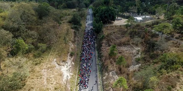 Migrants walk along a highway in hopes of reaching the distant United States, near Agua Caliente, Guatemala, in January 2020. (AP)