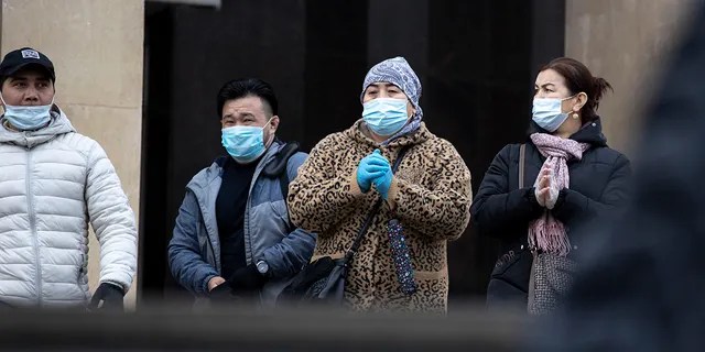 People wearing face masks to help curb the spread of the coronavirus leave a subway in Moscow, Russia, on Monday. Despite the sharp spike in daily new infections, Russian authorities have repeatedly dismissed the idea of imposing a second lockdown or shutting down businesses after most virus-related restrictions were lifted during the summer. (AP Photo/Alexander Zemlianichenko)