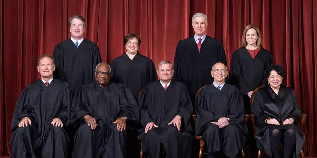Seated from left to right: Justices Samuel A. Alito, Jr. and Clarence Thomas, Chief Justice John G. Roberts, Jr. and Justices Stephen G. Breyer and Sonia Sotomayor. Standing from left to right: Justices Brett M. Kavanaugh, Elena Kagan, Neil M. Gorsuch,and Amy Coney Barrett.  (Photograph by Fred Schilling, Collection of the Supreme Court of the United States)