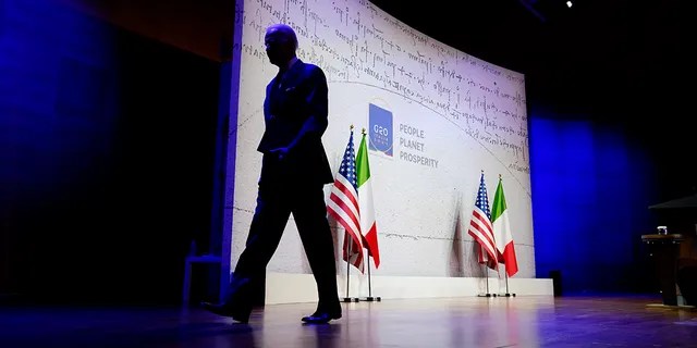 President Joe Biden walks off stage after speaking during a news conference at the conclusion of the G20 leaders summit, Sunday, Oct. 31, 2021, in Rome. (AP Photo/Evan Vucci)