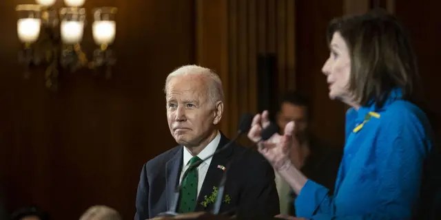 President Joe Biden listens as House Speaker Nancy Pelosi, D-Calif., speaks during the annual Friends of Ireland Luncheon at the Capitol in Washington, D.C., March 17, 2022.