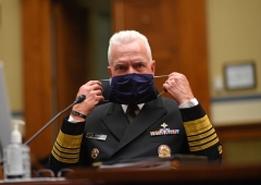 Admiral Brett Giroir, director of the US coronavirus diagnostic testing, adjust his face mask as he testifies during a House Subcommittee on the Coronavirus Crisis hearing on a national plan to contain the COVID-19 pandemic, on Capitol Hill in Washington, DC on July 31, 2020. (Photo by KEVIN DIETSCH/AFP via Getty Images)