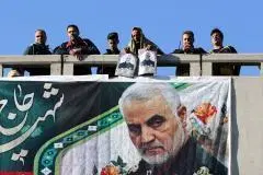 A banner featuring Qassem Soleimani's image is seen during his funeral in his hometown, Kerman, on January 7, 2020. (Photo by Atta Kenare/AFP via Getty Images)