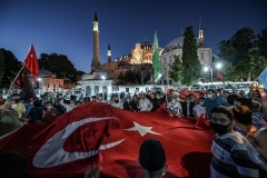 Muslims celebrate outside the Hagia Sophia on Friday after the court decision paved the way for the historic building to be reconverted into a mosque. (Photo by Ozan Kose/AFP via Getty Images)