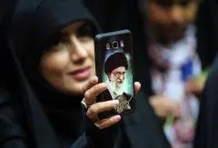 An image of supreme leader Ayatollah Ali Khamenei on an Iranian woman’s phone. (Photo by -/AFP via Getty Images)