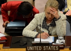 Secretary of State Hillary Clinton attends a U.N. Security Council meeting in 2012. Ambassador to the U.N. Susan Rice sits behind her. (Photo by Emmanuel Dunand/AFP/GettyImages)