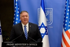 Secretary of State Mike Pompeo speaks to media in Jerusalem on Monday. During the visit he took time out to record a message for the RNC, aired on Tuesday night. (Photo by Debbie Hill/AFP via Getty Images)
