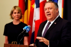 Secretary of State Mike Pompeo, flanked by U.S. Ambassador to the U.N. Kelly Craft, speaks at the U.N. on Thursday on the Iran sanctions ‘snapback’ initiative. (Photo by Mike Segar/Pool/AFP via Getty Images)