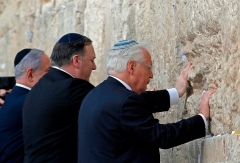 Secretary of State Mike Pompeo prays at the the Western Wall in Jerusalem’s Old City during a previous visit. With him are Israeli Prime Minister Binyamin Netanyahu and U.S. Ambassador to Israel David Friedman. (Photo by Jim Young/Pool/AFP via Getty Images)