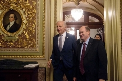 Vice President Joe Biden walks out of the Senate chamber with Sen. Chris Coons (D-Del.) after attending a bipartisan tribute honoring Biden's service as a member of the Senate and as vice president on December 7, 2016. (Photo by Nicholas Kamm/AFP via Getty Images)