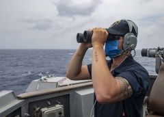 A U.S. Navy sailor on the on the bridge wing of the guided missile destroyer USS Mustin in the South China Sea on Thursday. (Photo: U.S. Navy/MC3 Cody Beam)