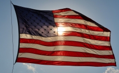The American flag swirls in the wind. (Photo credit: Gary Hershorn/Getty Images)