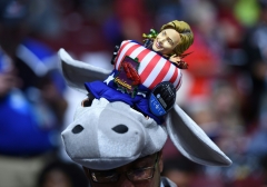 Featured is a hat bearing the Democrat donkey and a likeness of Hillary Clinton. (Photo credit: TIMOTHY A. CLARY/AFP via Getty Images)