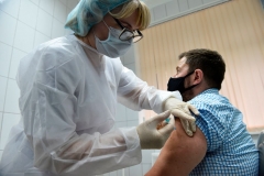 A nurse inoculates volunteer Ilya Dubrovin, 36, with Russia's new coronavirus vaccine in a post-registration trials at a clinic in Moscow on September 10, 2020. - Russia announced last month that its vaccine, named "Sputnik V" after the Soviet-era satellite that was the first launched into space in 1957, had already received approval. The vaccine was developed by the Gamaleya research institute in Moscow in coordination with the Russian defence ministry. (Photo by NATALIA KOLESNIKOVA/AFP via Getty Images)