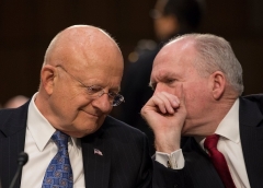 Then-Director of National Intelligence James Clapper, left, and CIA Director John Brennan on Capitol Hill in 2016. (Photo by Molly Riley/AFP via Getty Images)