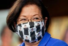 Sen. Mazie Hirono (D-Hawaii) wears a mask depicting former Supreme Court Justice Ruth Bader Ginsburg at the Oct. 12 hearing for Supreme Court nominee Judge Amy Coney Barrett. (Photo by LEAH MILLIS/POOL/AFP via Getty Images)