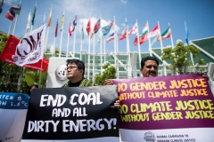 Environmental activists display placards during a demonstration in front of the United Nations building in Bangkok on Sept. 7, 2018. (Photo credit: JEWEL SAMAD/AFP via Getty Images)