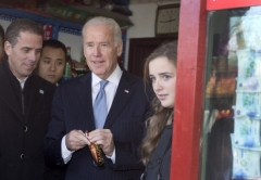Then-Vice President Joe Biden with his granddaughter Finnegan and son Hunter Biden in Beijing on December 5, 2013. (Photo by ANDY WONG/AFP via Getty Images)