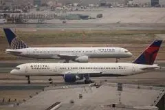 Boeing 757s taxi past each other at Los Angeles International Airport. Coronavirus-related restrictions have seen passenger numbers drop ‘to a level not seen since before the dawn of the jet age.’ (File photo by John Gress/Corbis via Getty Images)