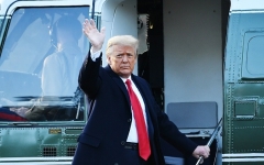 Outgoing President Donald Trump waves as he boards Marine One at the White House for the trip to Florida on January 20, 2021. (Photo by MANDEL NGAN/AFP via Getty Images)