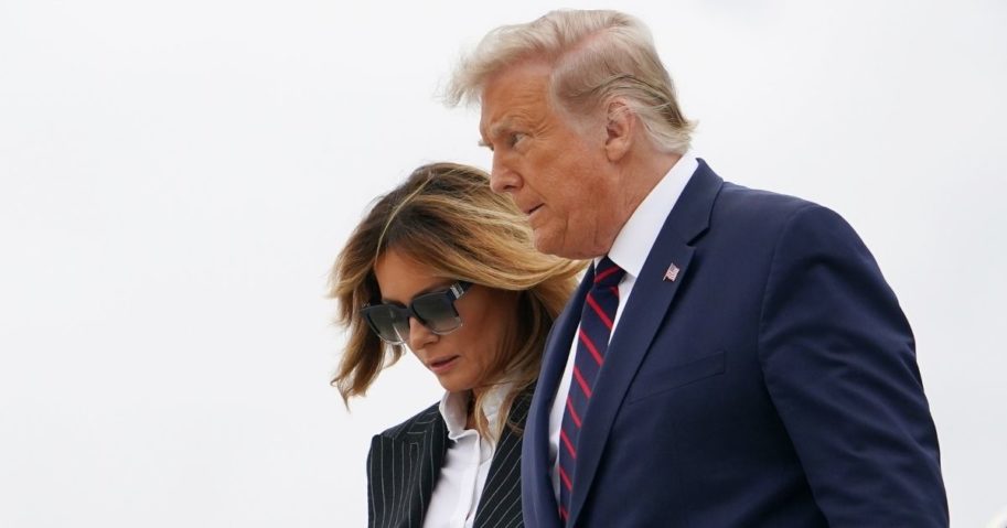 President Donald Trump and First Lady Melania Trump step off Air Force One upon arrival at Cleveland Hopkins International Airport in Cleveland on Tuesday.