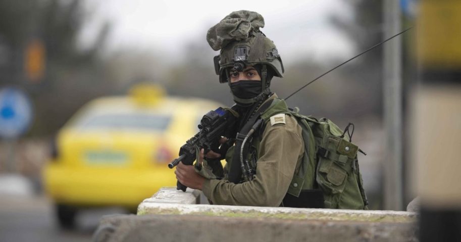An Israeli soldier is pictured in a file photo after a Nov. 4 attack by a Palestinian gunman in the West Bank city of Nablus.